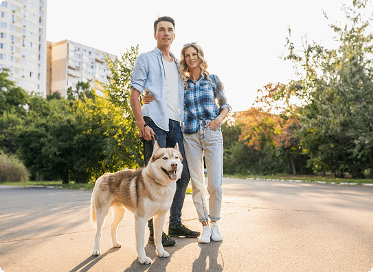 Couple with dog outdoors